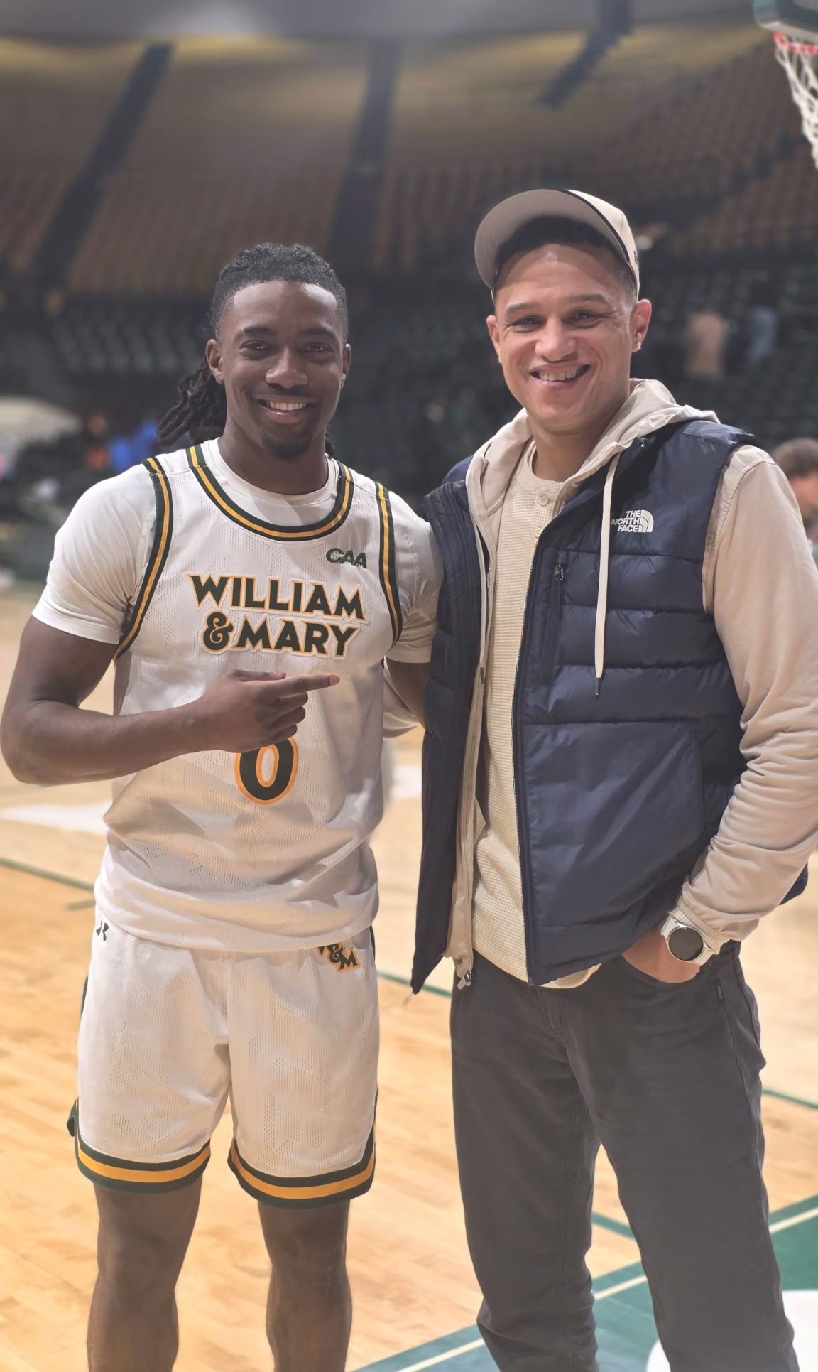 Coach David with a basketball player